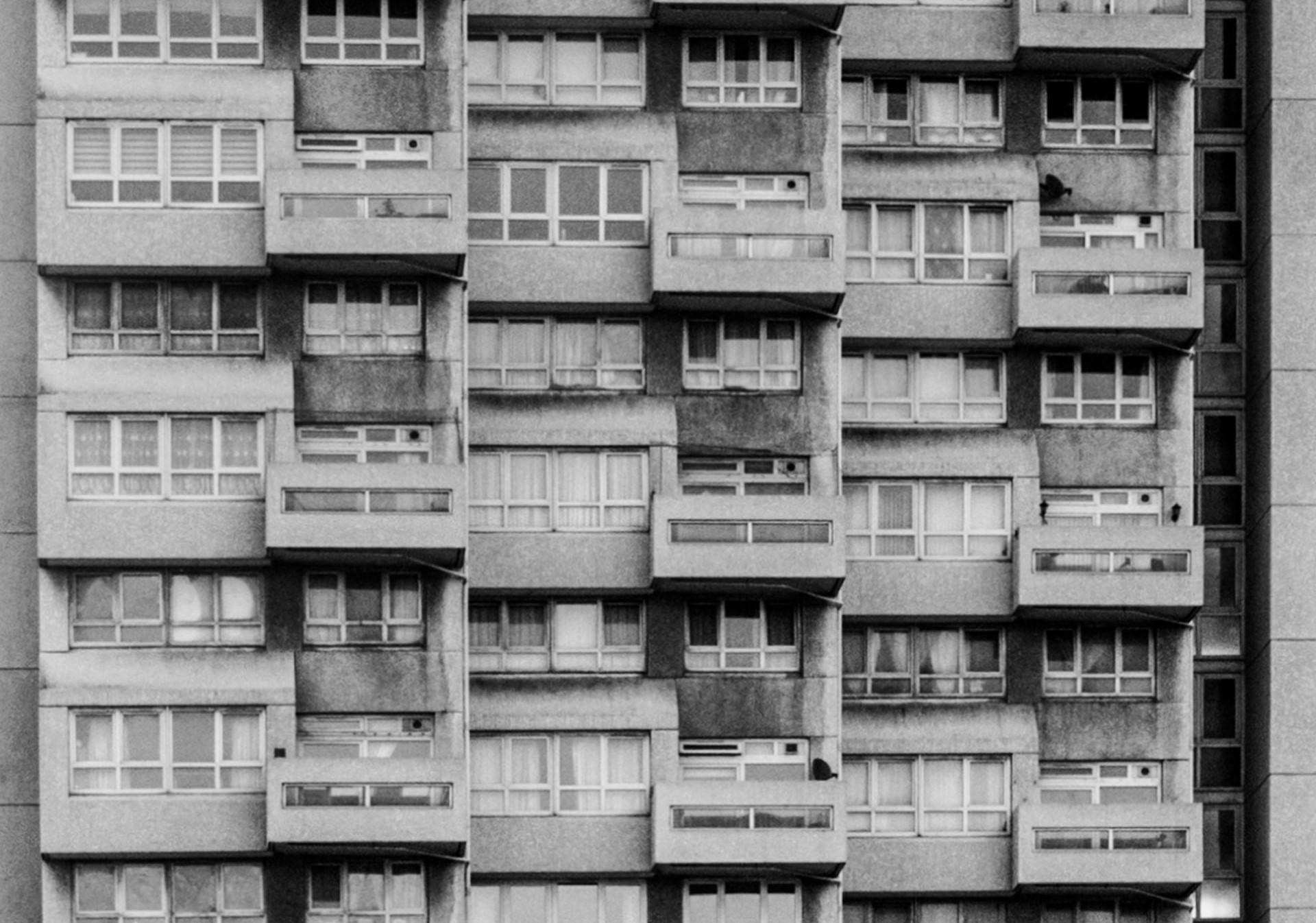 A black and white image of a block of high rise flats