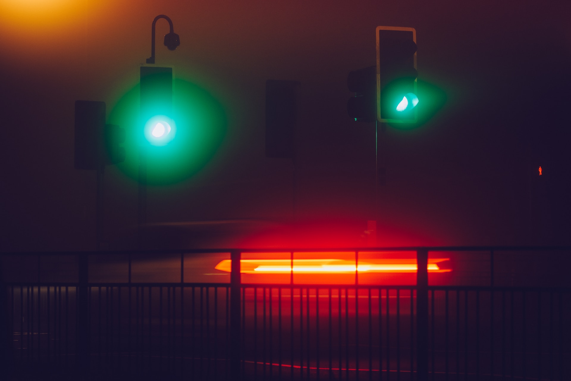two sets of traffic lights at night