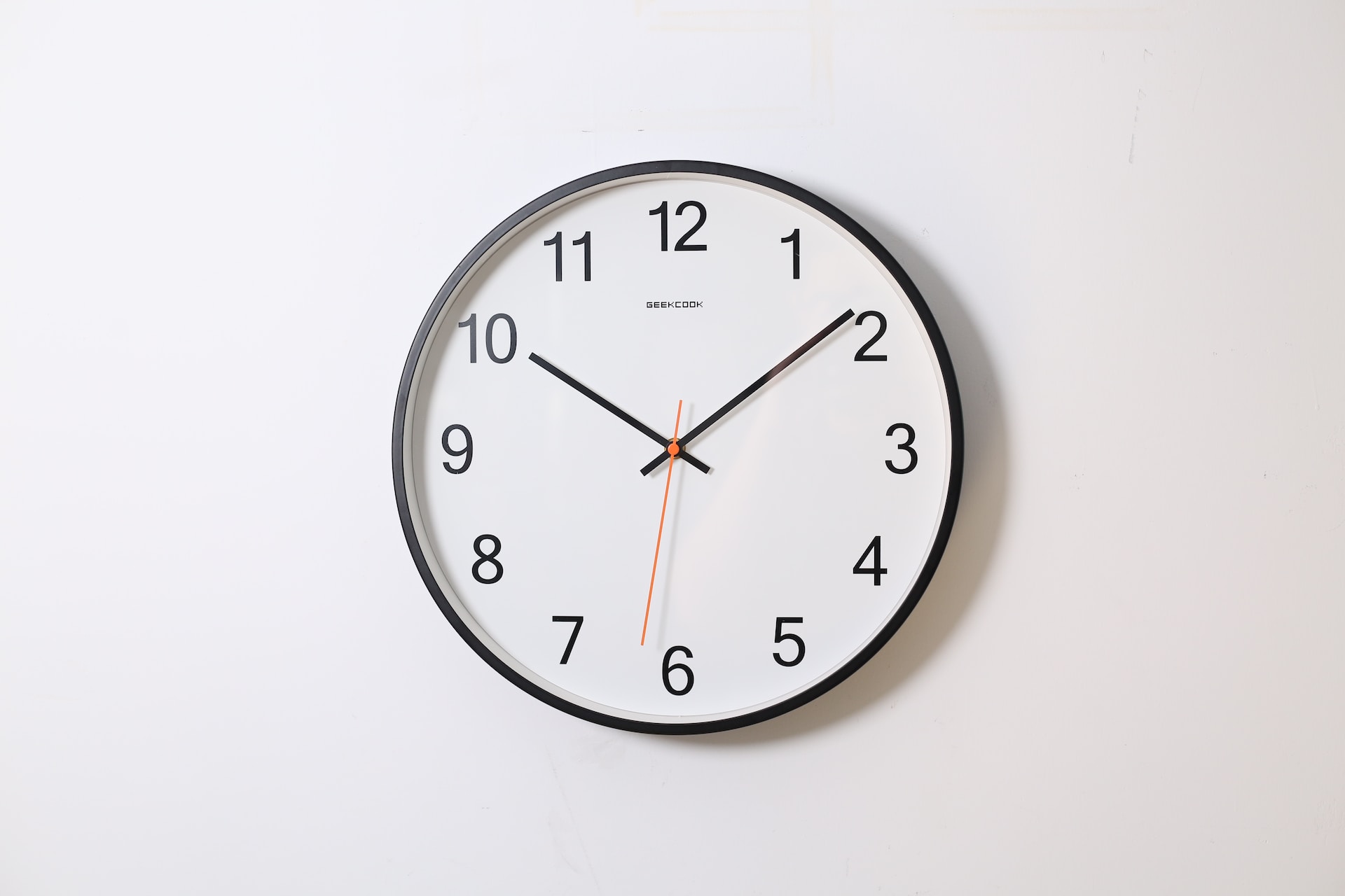 A wall clock showing ten past ten