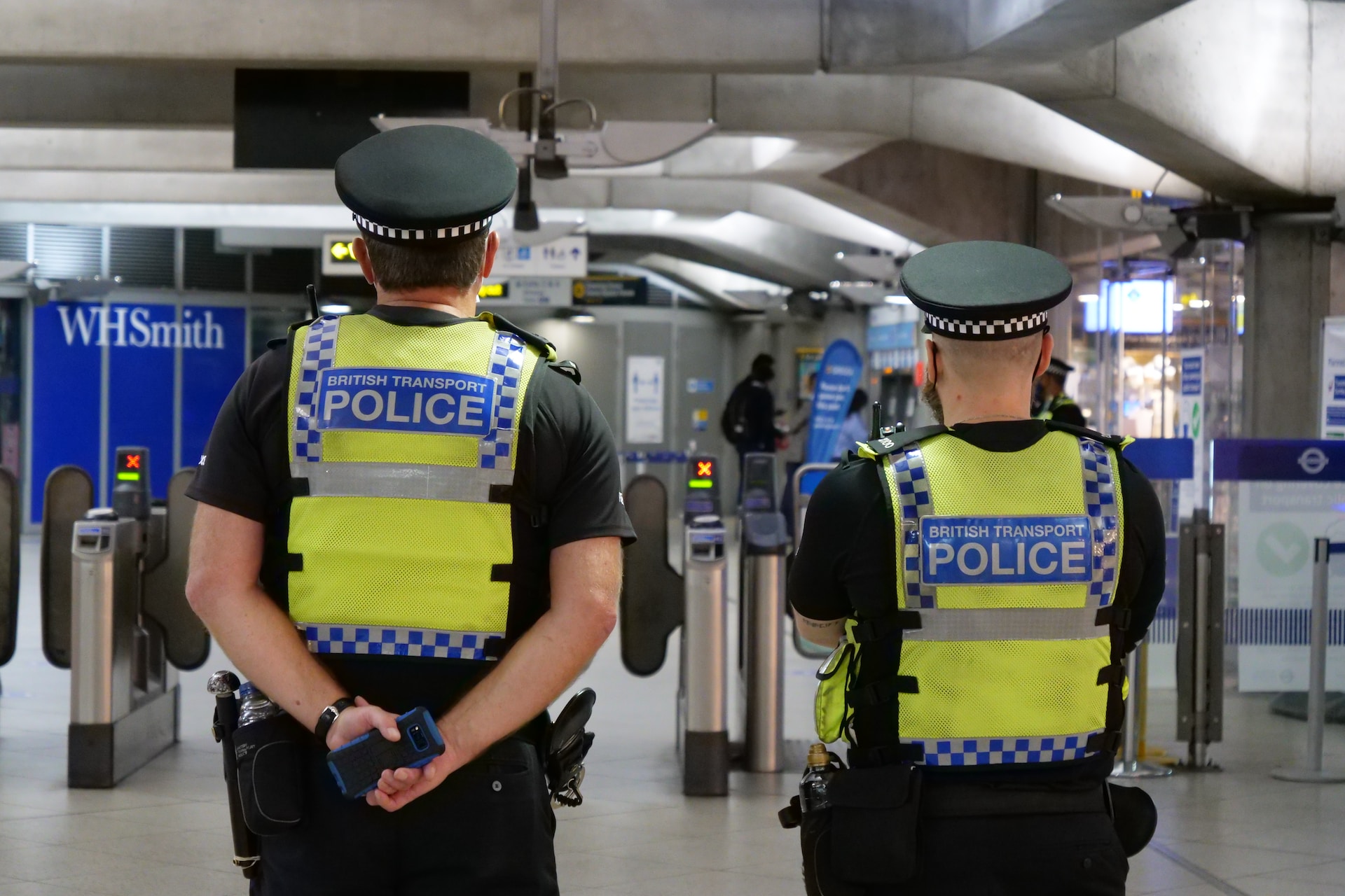 Two police officers standing at Westminster station