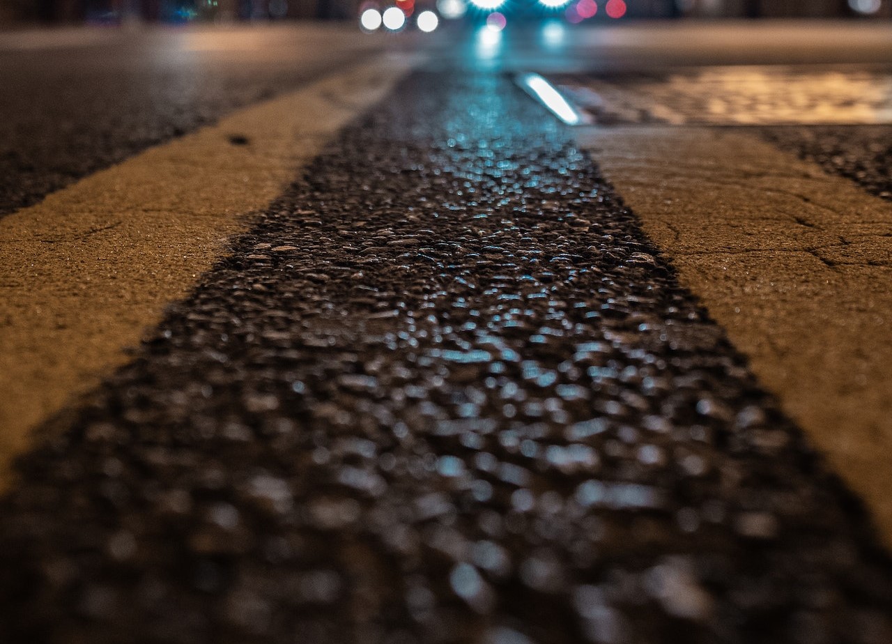 A close up shot of a pedestrian crossing at night