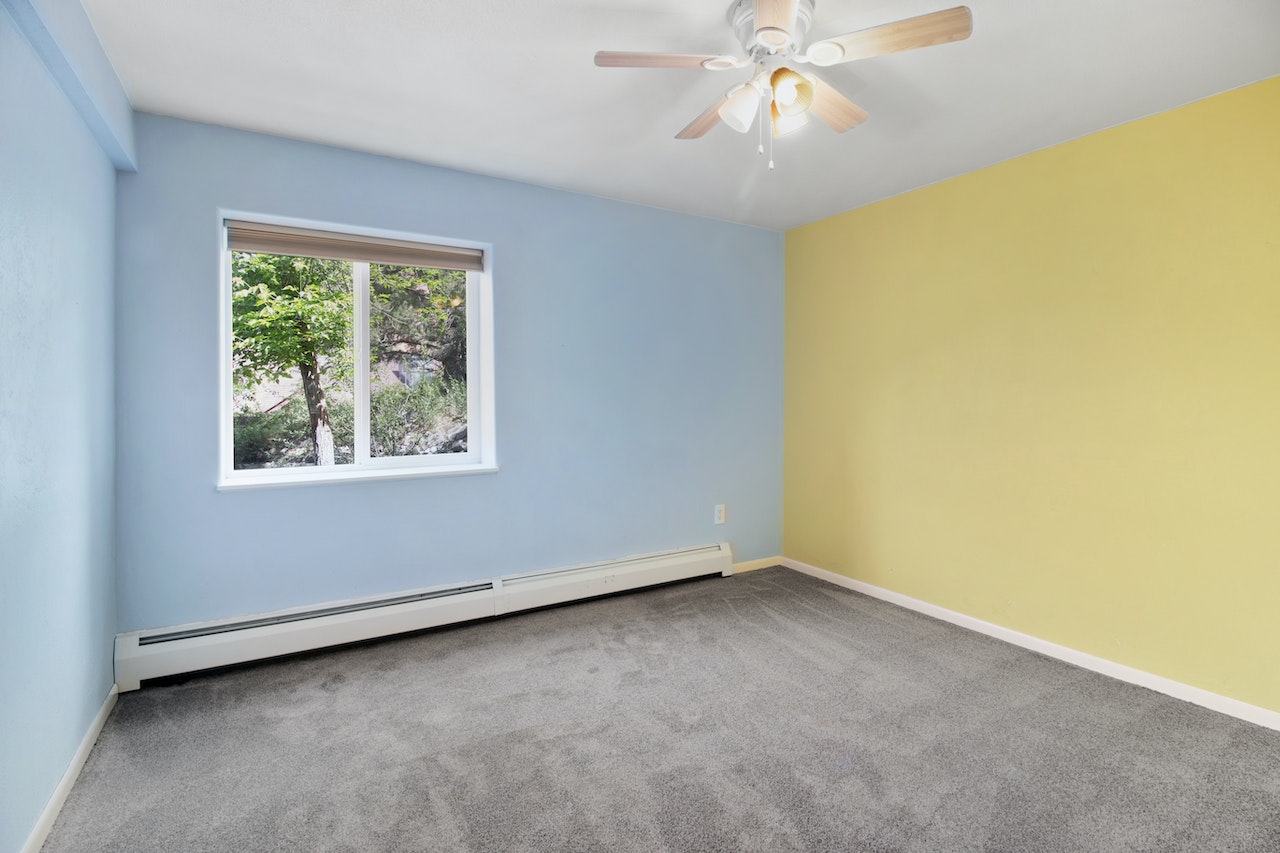A room with blue and yellow walls