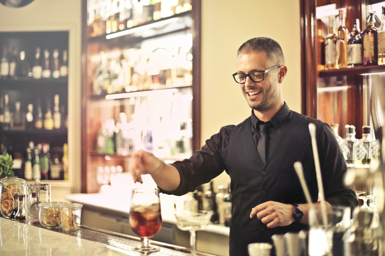 A bartender making a drink