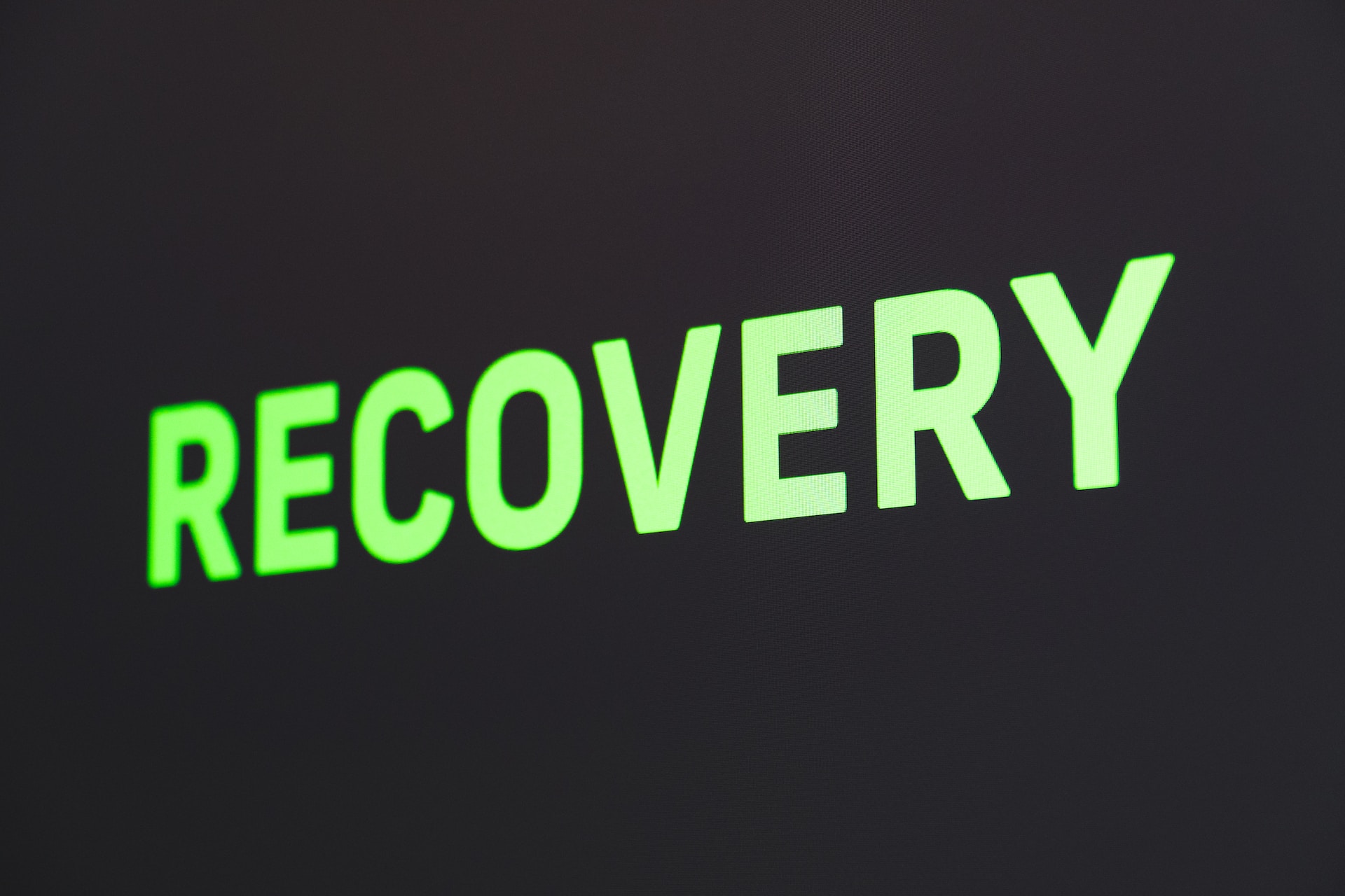 "Recovery" in green on a black background