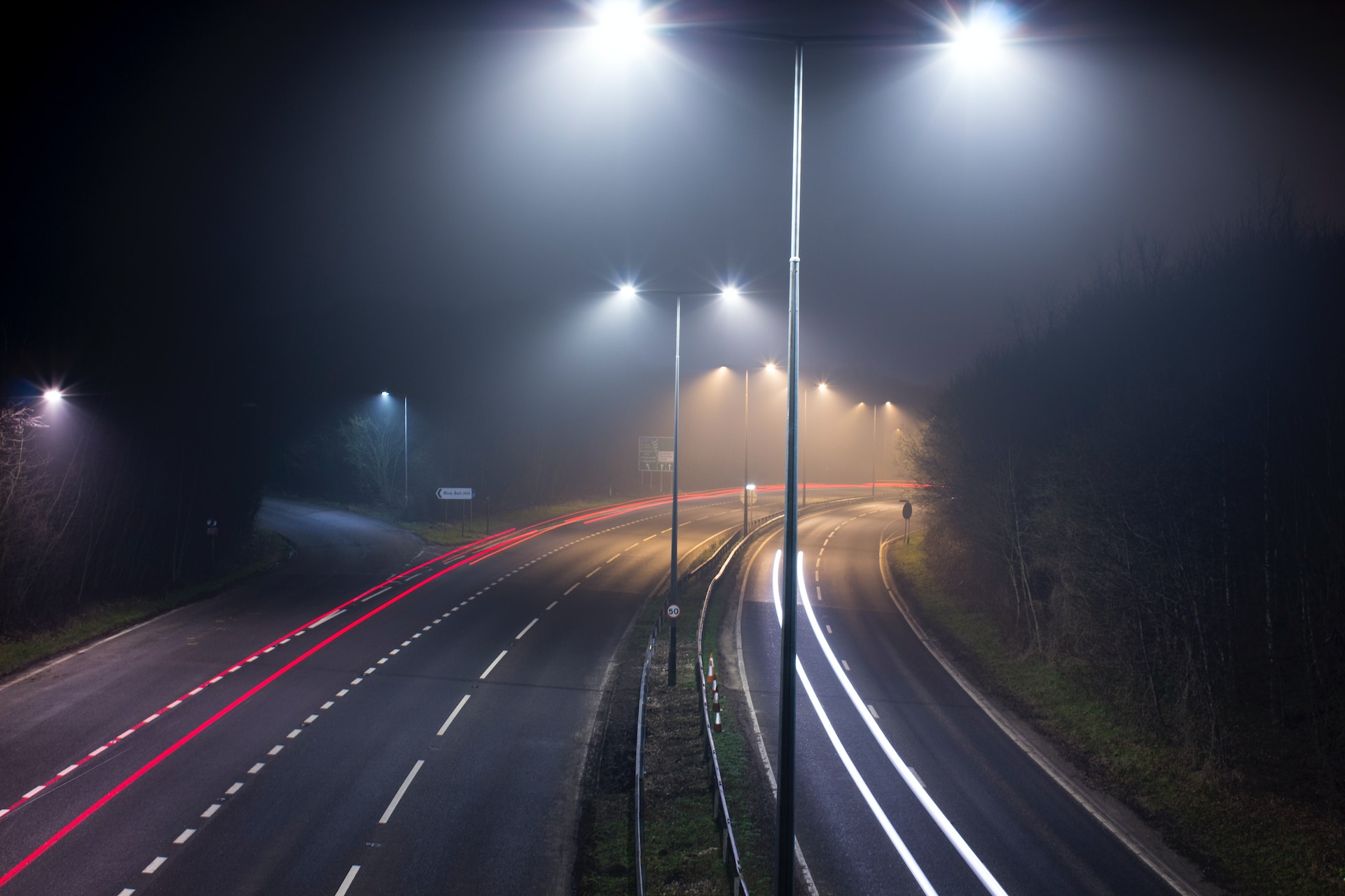 Well lit empty UK motorway at night
