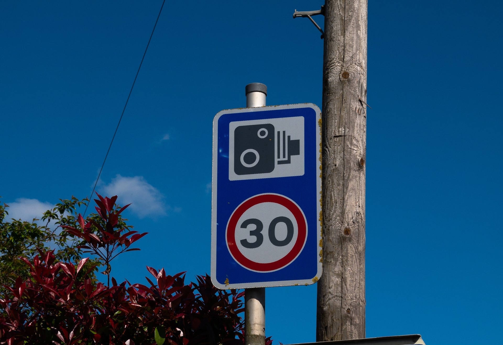 A road sign warning drivers of an upcoming speed camera