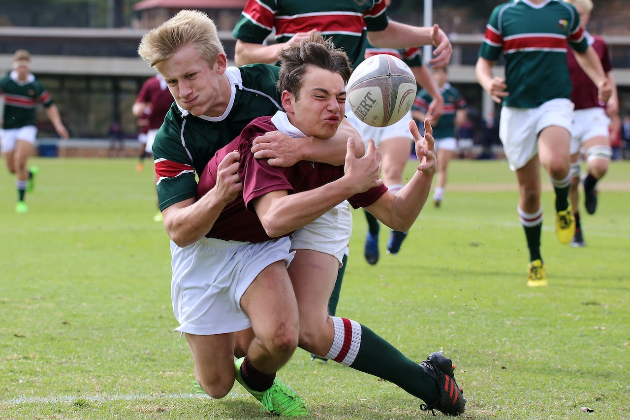 Two people playing rugby