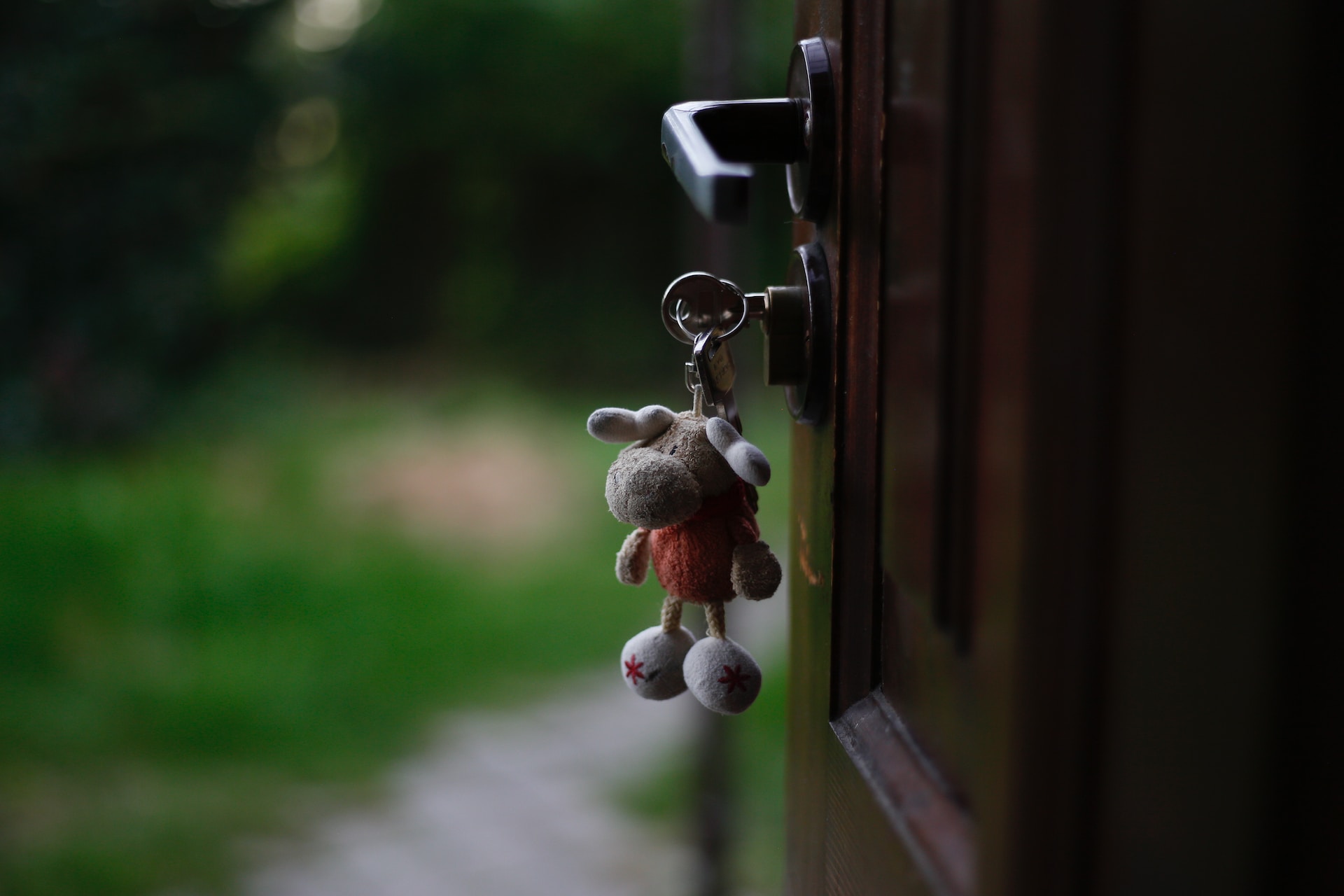 A keyring on a key inside a front door