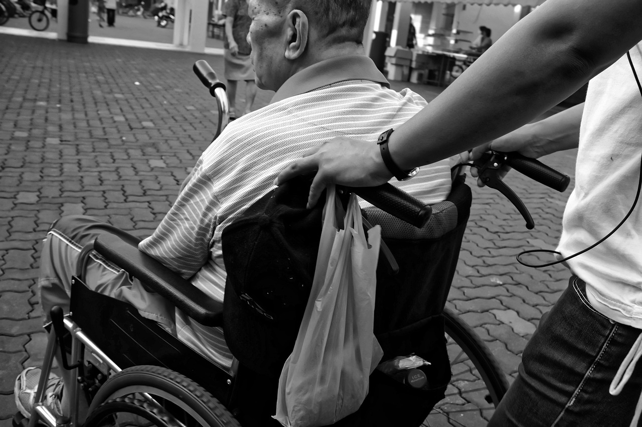 Someone being cared for in a wheelchair
