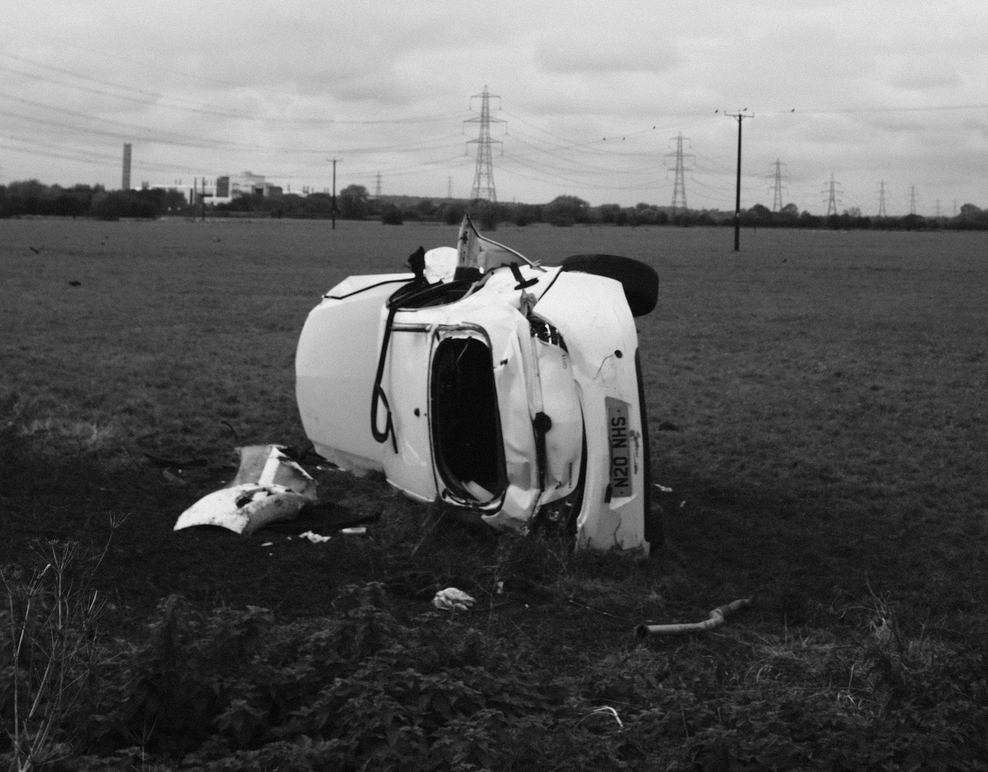 A car overturned on a field