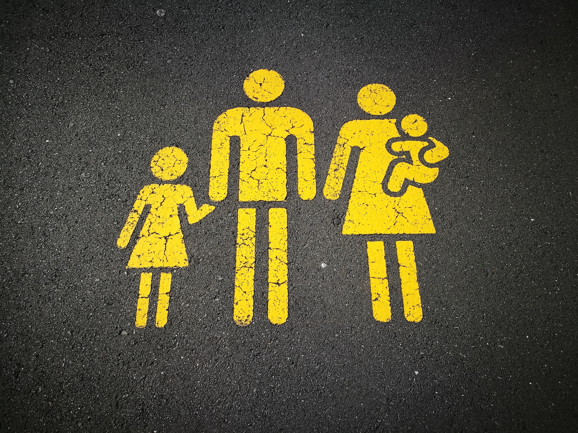 A street sign depicting a family