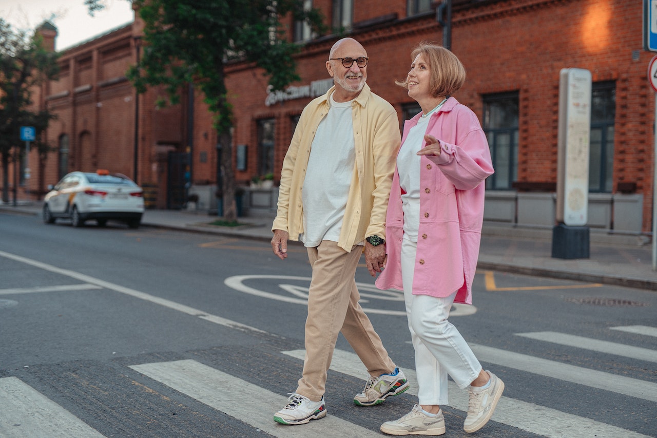 older couple crossing the road
