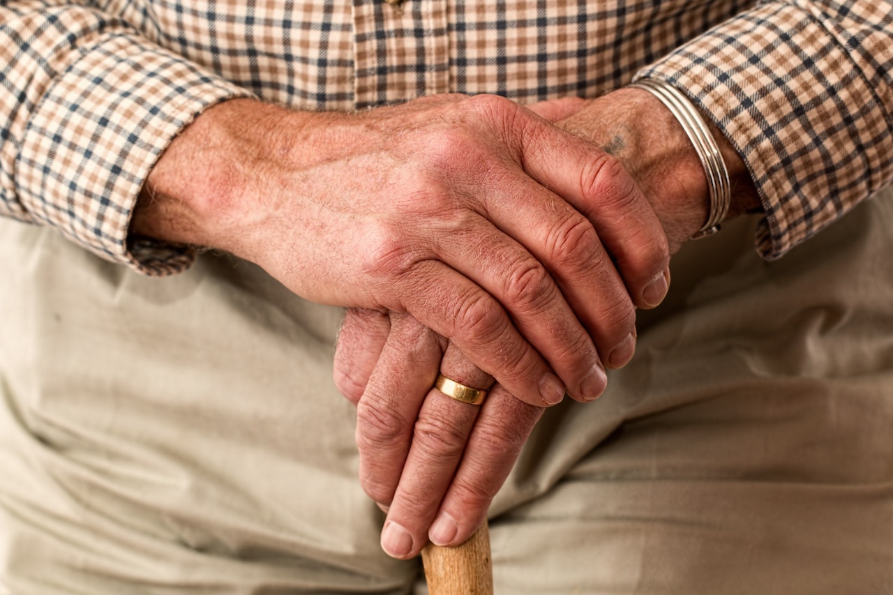 Older persons hands crossed