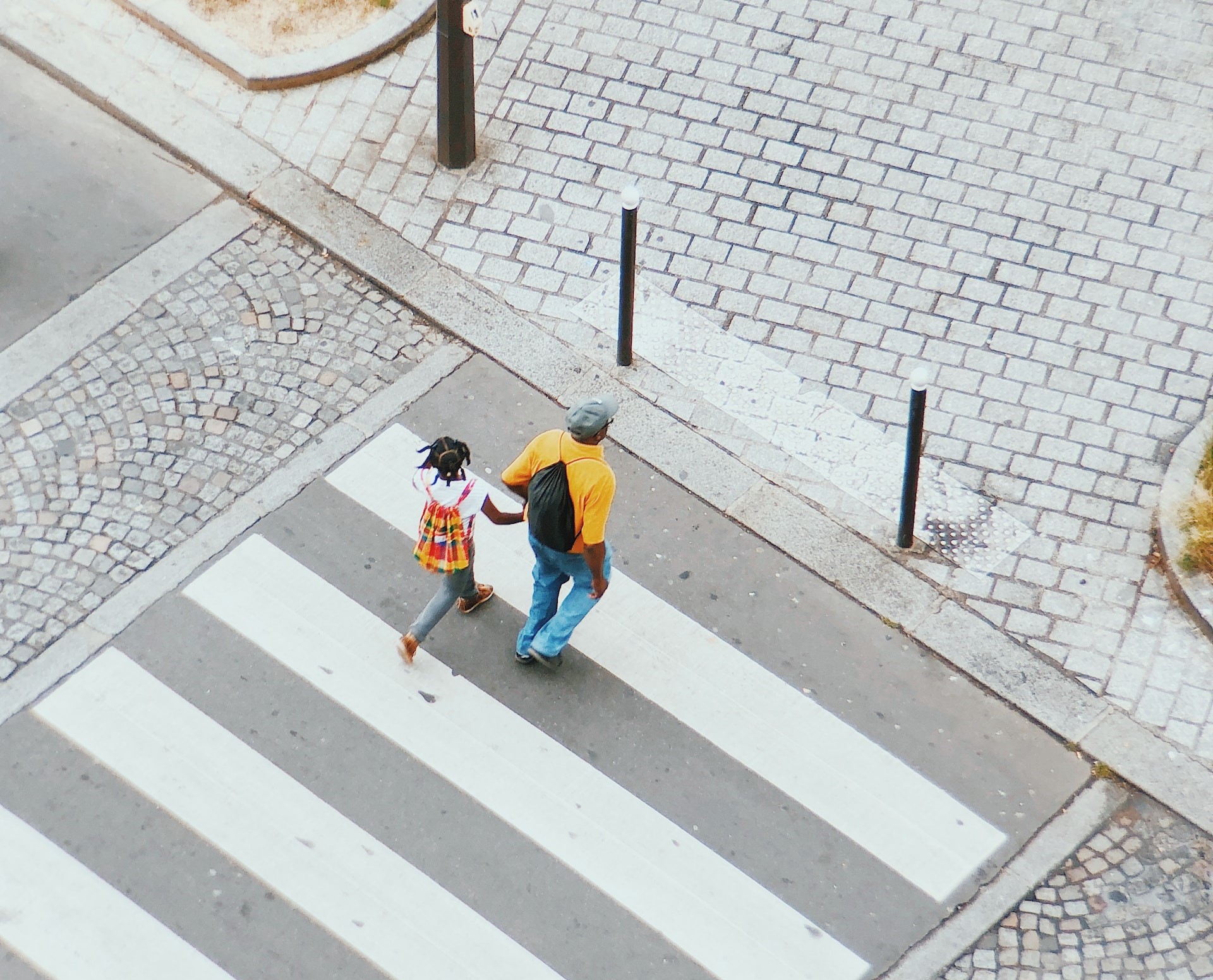 adult and child on a pedestrian crossing