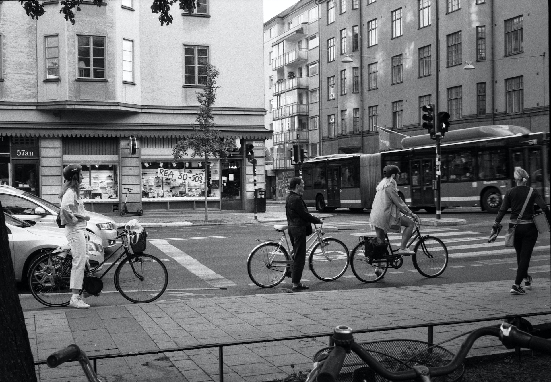 Cyclists waiting at a pedestrian crossing