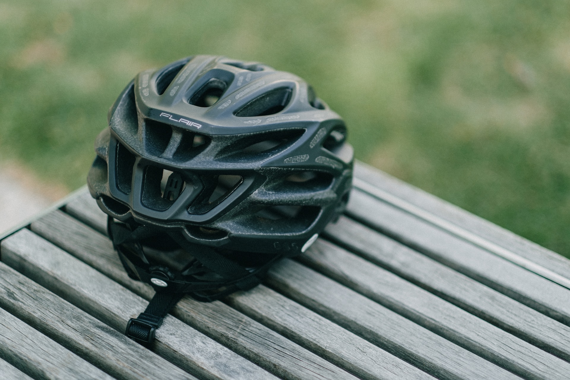 A cycling helmet on a bench