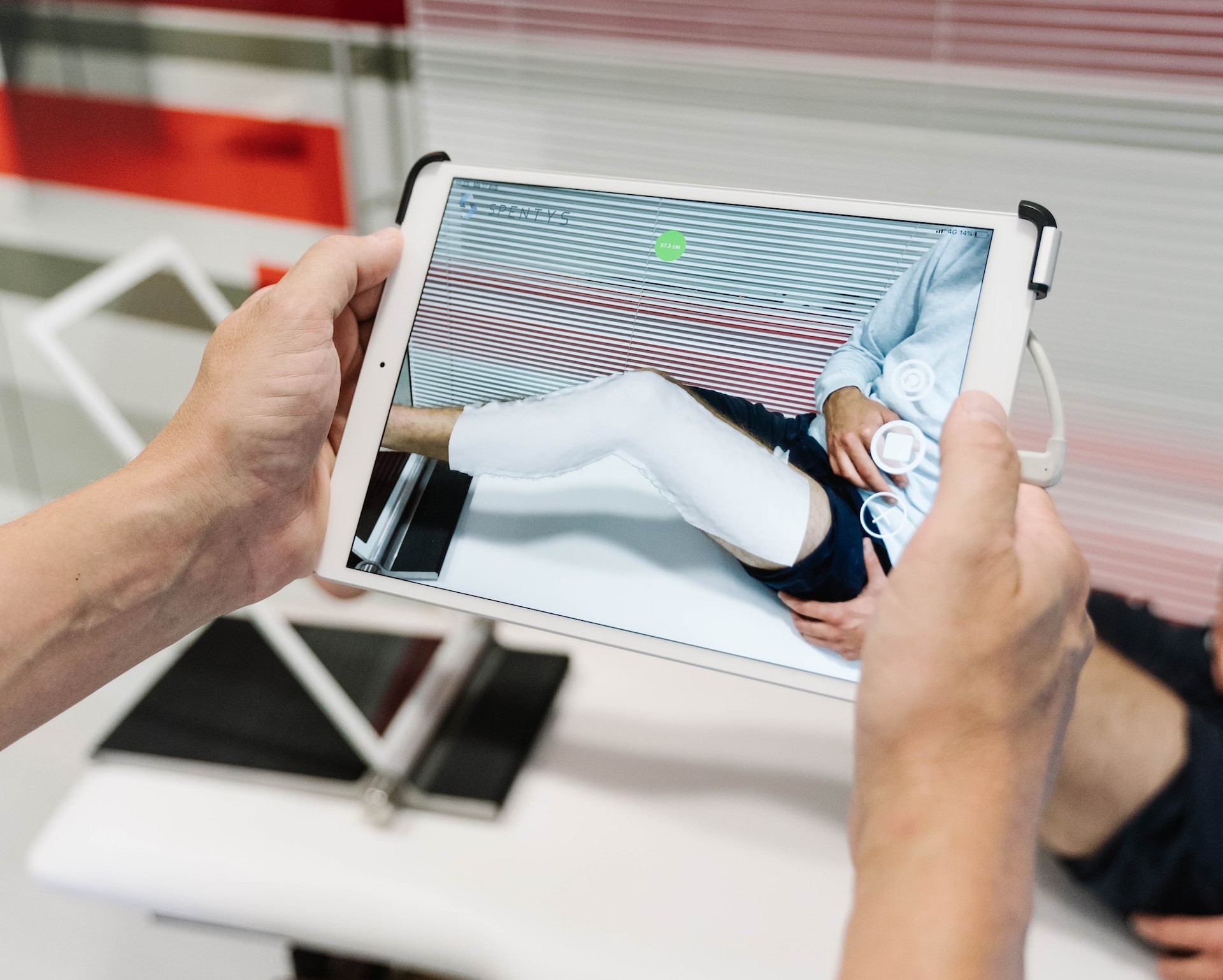 A doctor using a tablet during rehabilitation