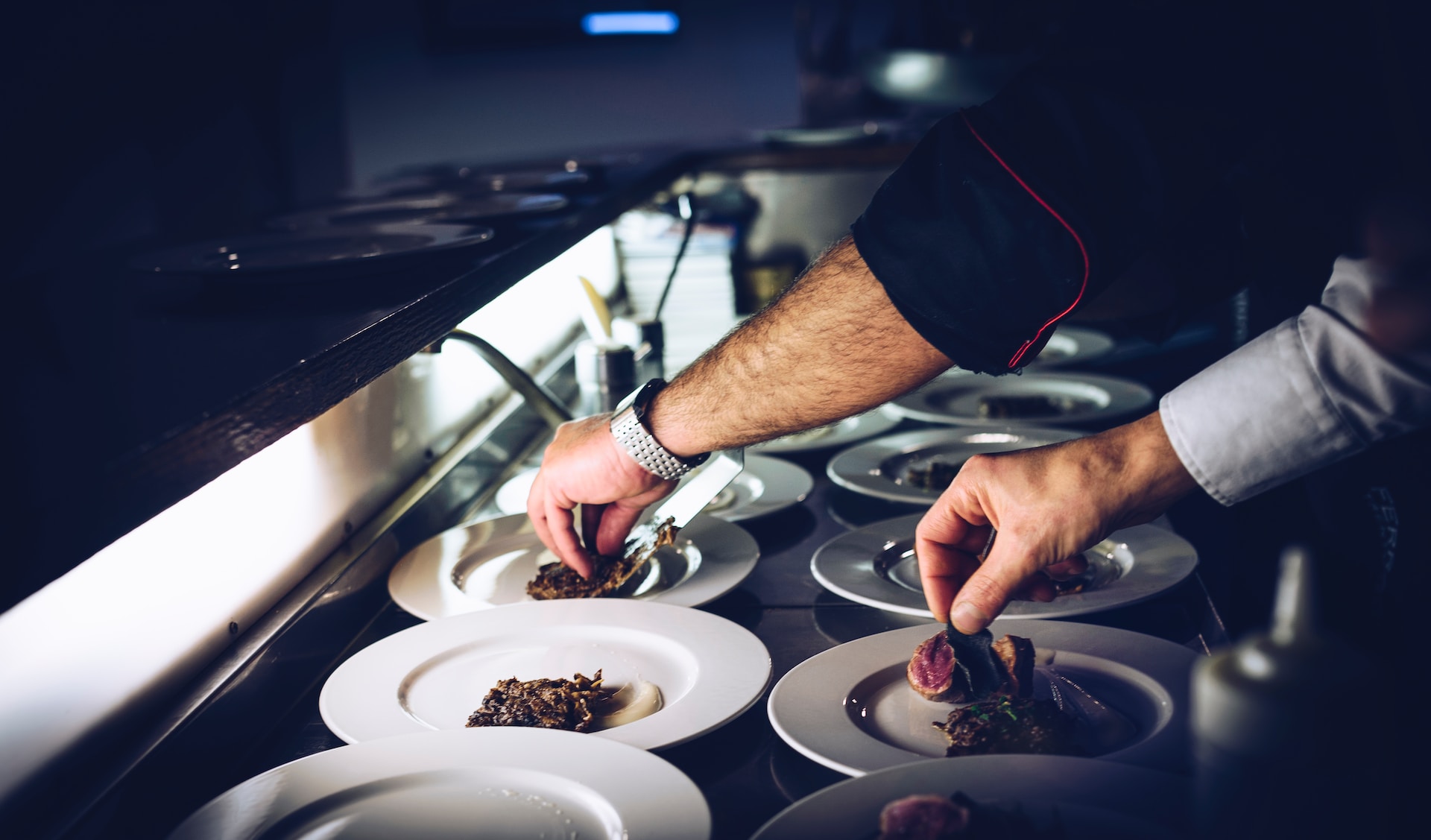 A chef plating food