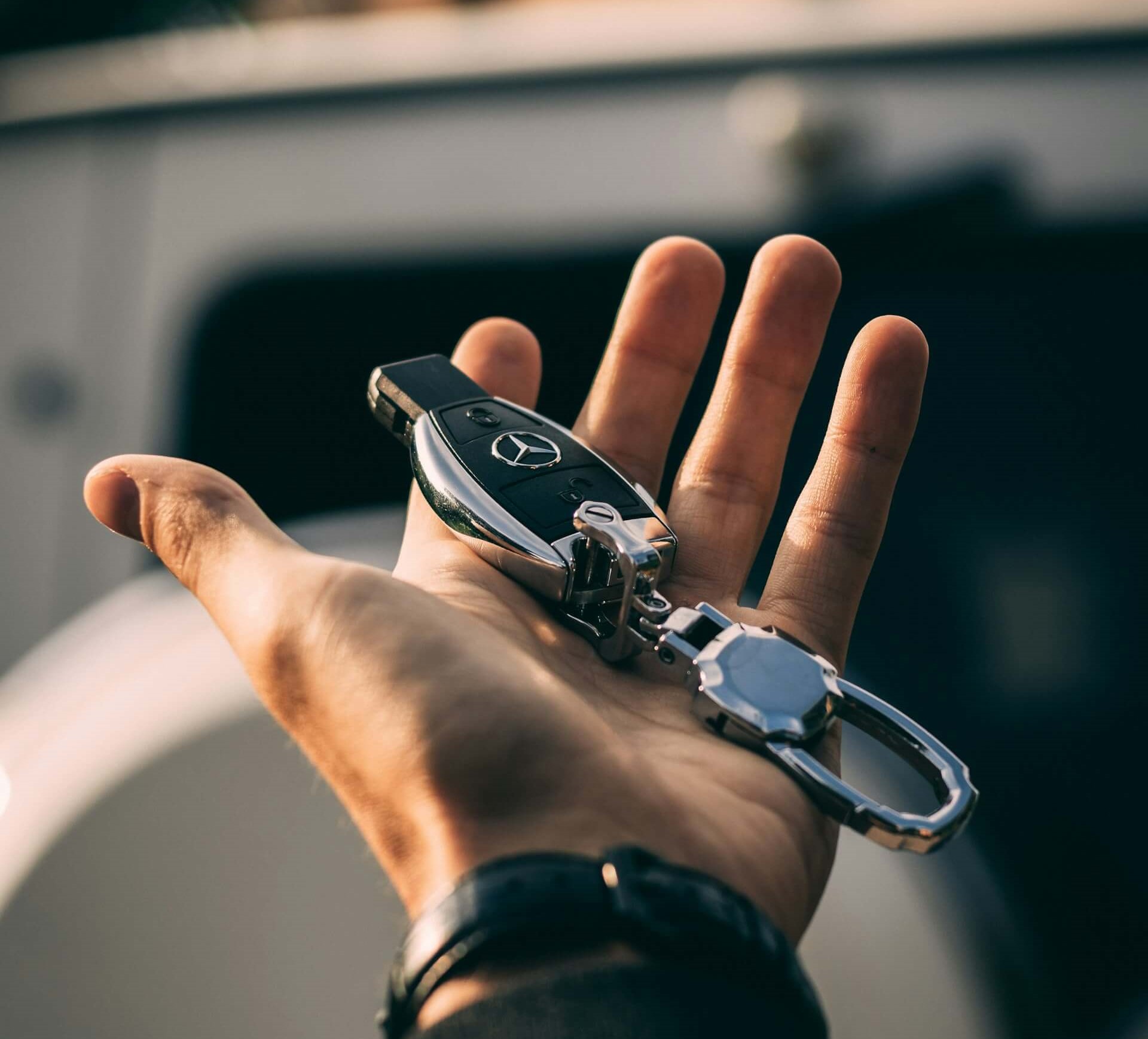 Someone holding a set of car keys