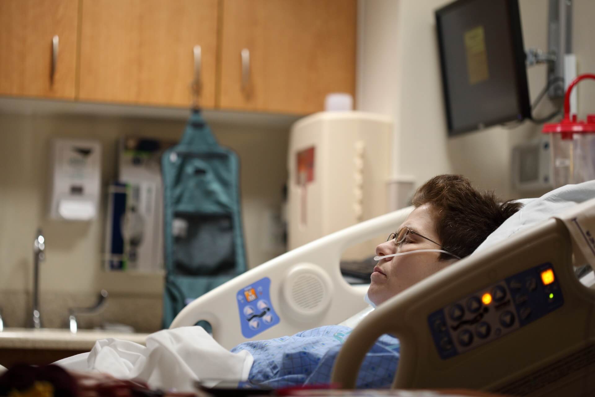 A patient waiting in a hospital bed