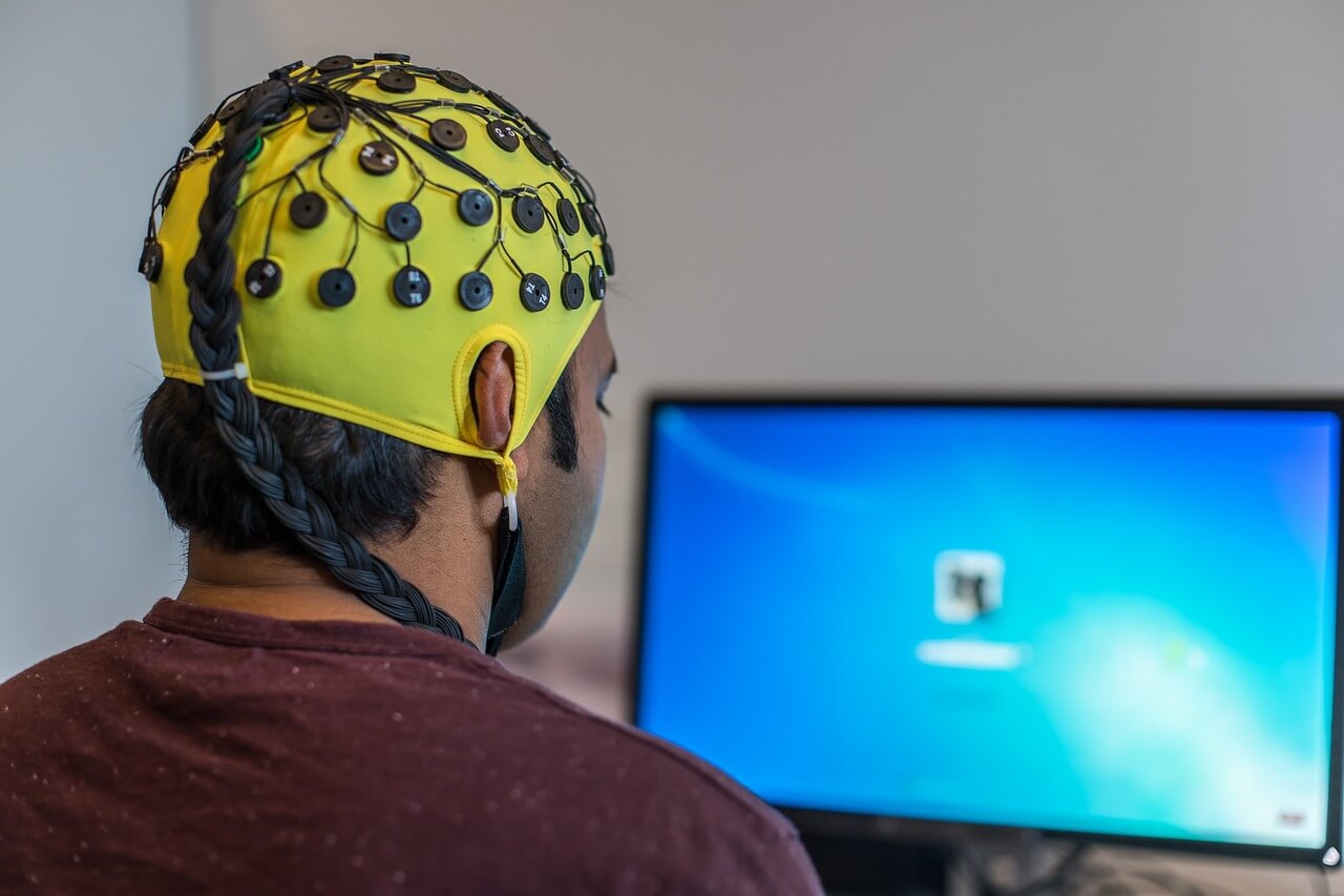 Someone wearing a neurorehabilitation piece of equipment on their head