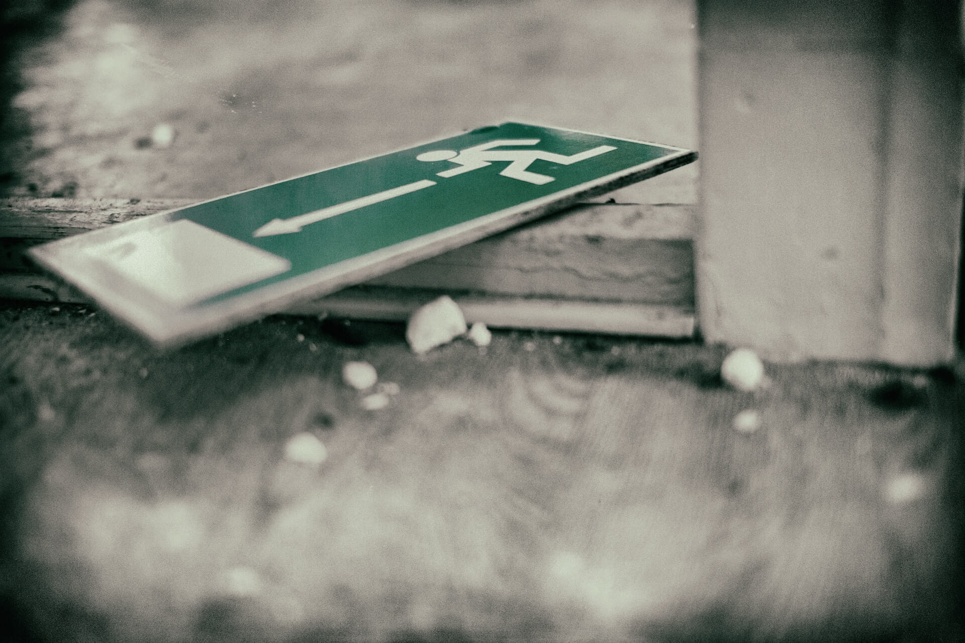 A fire exit sign on the floor