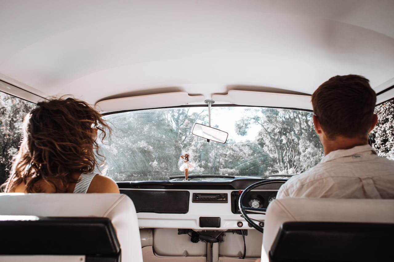 Two people in a campervan