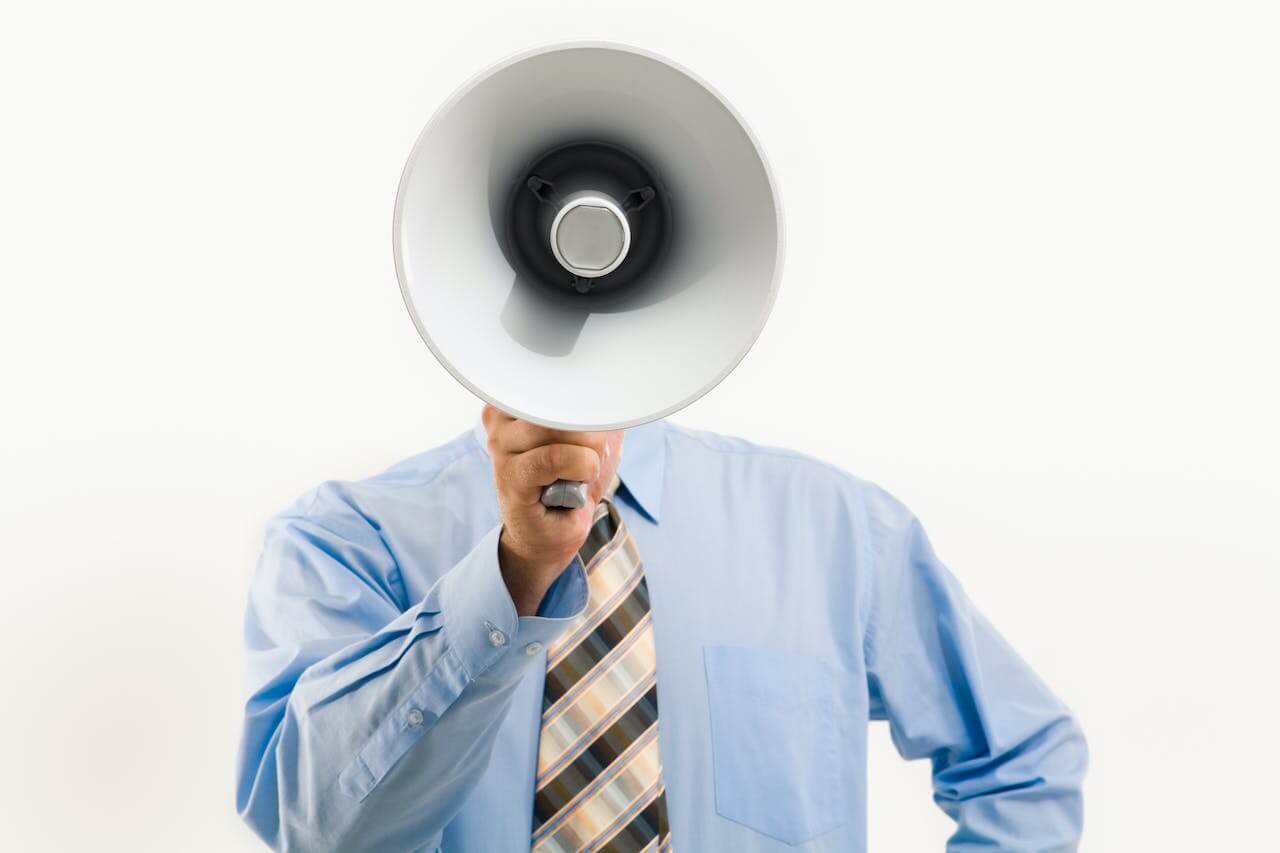 An office worker with a megaphone