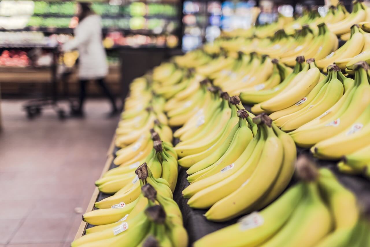A row of bananas in a supermarket
