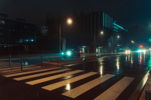 A pedestrian crossing at night